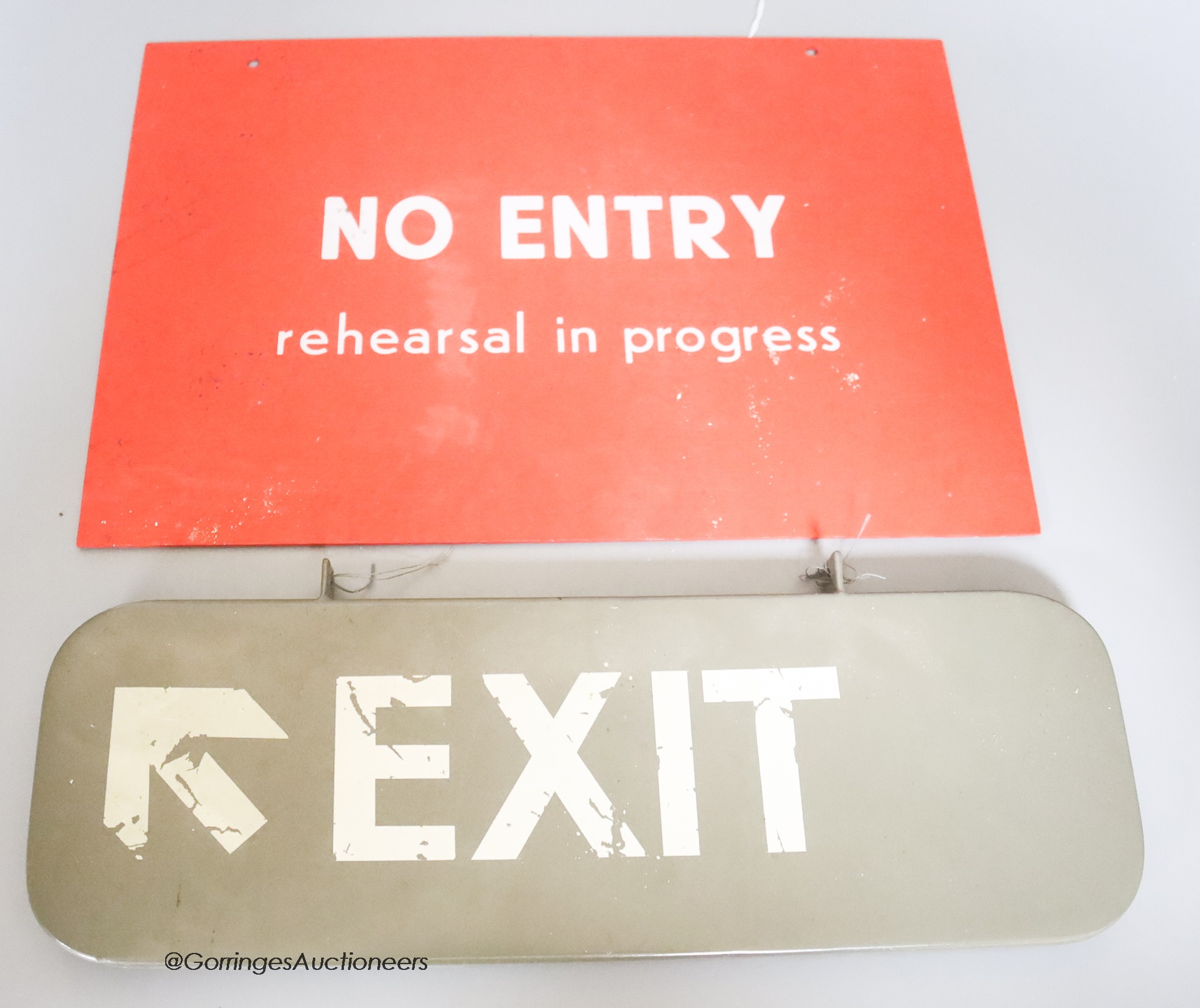 A 20th century 'exit' and 'No Entry Rehearsal in Progress' sign